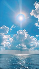Leinwandbilder - The sky is blue with a sun shining through the clouds