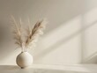 A tranquil scene of minimalism a vase with flowing pampas grass set against a peaceful, simple backdrop