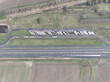 Aerial drone view on a truck stop along the road. Road logistics and shipping. Top down view.