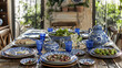 A table is adorned with various blue and white dishes and plates neatly arranged in a symmetrical manner