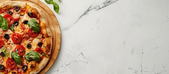 Wall Mural - Top-down view of a wooden circular board placed on a white stone kitchen table, with a wooden pizza platter and empty space for text.