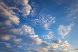 Fototapeta  - Picturesque view of orange sky with dark clouds in sunset time. Textured background of beautiful sunset. Beautiful background blur.