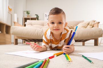 Poster - Cute little boy drawing with felt-tip pens on floor at home