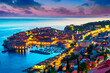 Dubrovnik, Croatia: Sunset view on the old town (medieval Ragusa) surrounded by fortified walls above the Adriatic sea and Dalmatian Coast of Adriatic Sea