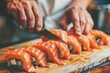 Skilled experienced japanese master chef preparing sushi rolls traditional cuisine restaurant bistro slicing fresh salmon fish tasty delicious gourmet dish seafood rice cook preparing order