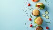 Fresh burgers with ingredients scattered on blue surface