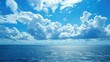Sky with clouds and ocean of blue