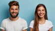 © JovialFox - Portrait of attractive smiling couple posing isolated on blue background. Happy bearded man and beautiful woman wearing stylish white t shirt looking at camera in studio