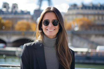 Wall Mural - Woman wearing sunglasses and a black jacket is smiling at the camera