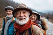 © Loli - Happy senior couple hiking in the mountains. They are wearing hats and scarves.