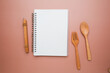 The mock up note book with spoon and fork for meal plan, cooking, recipe, menu and template.