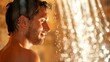 © Justlight - A man taking a contrast shower alternating between hot and cold water to improve circulation and promote quicker recovery after physical exertion. .