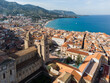 Cefalu, Italy: Aerial view of the famous Cefalu old town with its Norman mediveval cathedral in Sicily, Italy. The town is a very popular summer holiday destination