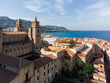 Cefalu, Italy: Aerial view of the famous Cefalu old town with its Norman mediveval cathedral in Sicily, Italy. The town is a very popular summer holiday destination