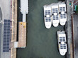 An aerial view of Solar powered shuttle boats parked at the solar port.