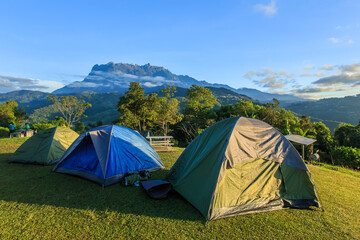 Wall Mural - Camping point at morning with mount Kinabalu at far background.