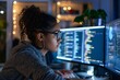 Female Software Engineer Working Intensely on Multiple Computer Screens at Night