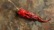 A dried red pepper with the stem removed