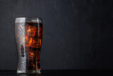 Fototapeta Desenie - Cola with ice in glass