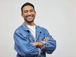 © peopleimages.com - Happy, man and portrait with arms crossed, fashion and modern style in a studio with smile. Trendy, denim and cool outfit with confidence and classic casual clothes with jacket and grey background