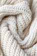 Close up of cotton white crochet texture in waves , transpirable mesh fabric for clothing
