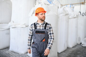 Wall Mural - Portrait of factory worker. Young handsome factory worker