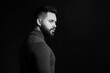 © New Africa - Portrait of handsome bearded man on dark background, space for text. Black and white effect
