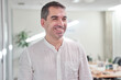 © Oscar - portrait of a smiling businessman in a modern office