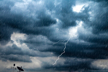 Lightning and thunderstorm flash with raining background. Bad weather and cloudy problem with aerial or satellite signal.