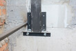Close up on pillar metal holder in concrete wall