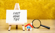 First home tips concept. Pieces of advice and guidance aimed at individuals who are buying their first home. Miniature house and magnifying glass