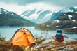 © VisualProduction - Child traveling with camping tent gear active family vacations kid hiking outdoor healthy lifestyle adventure trip exploring mountains of Norway