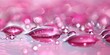 Vibrant Hyaluronic Acid Drops on Pink Background