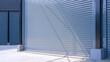 Automatic gray roller shutter entrance door of industrial warehouse building in factory area, perspective side view