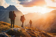 © VisualProduction - Group of 3 people hiking in mountains in sunrise. Friends hiking in the mountains.