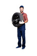 © deagreez - Full size body portrait of cheerful attractive mechanic with stubble in blue overall, shirt, cap having, holding tire in arms, looking at camera, isolated on grey background
