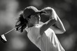 © kilimanjaro  - The elegance and concentration of professional female golfer, her form perfect against the backdrop