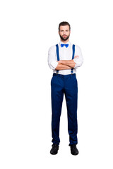 Canvas Print - Full size full body portrait of famous talented singer in blue ourfit, wearing bow, white shirt, suspenders, isolated over grey background, holding arms crossed