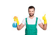 Portrait of cheerful joyful cleaner in uniform overall with stubble holding equipment in hand showing thumbup yes done recommend sign with finger isolated on grey background