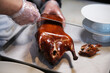 cooking Peking duck. Chef's hand slicing roasted Peking duck. Traditional Chinese food