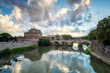 Beautiful view of medieval Saint Angelo castle and Vittorio Emanuele II Bridge over Tiber river in Rome, Italy.