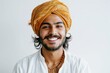 portrait of young Indian man in a turban smiling to camera