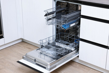 Sticker - Open clean empty dishwasher in kitchen. Home appliance