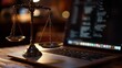 © pier - traditional scales of justice on a wooden desk with modern coding laptop backdrop