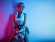 Sexy girl in an erotic school costume with a plaid skirt from a sex shop with a teddy bear on a neon background from a copy paste poses erotically