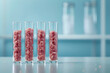 4 lab glass tubes with cultured meat staying on the table in a laboratory. Cellular agriculture, cultivated meat scientific research, future food concept. Science background with copy space.