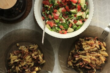 Wall Mural - Fried potatoes with chanterelles and salad