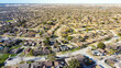 Urban sprawl DFW Dallas Fort Worth subdivision design with multiple cul-de-sac dead-end residential street that shapes like keyholes, aerial view single family houses swimming pools backyard