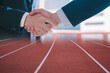 Business partner joint venture concept, multi exposure businessman shaking hands with partner on running track background for dealing agreement negotiation business start up target and goal