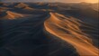 an aerial view of a sand dune in the desert at sunset